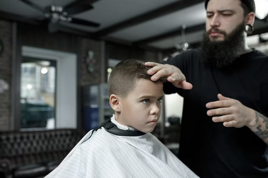 Kid getting a haircut at the barber's