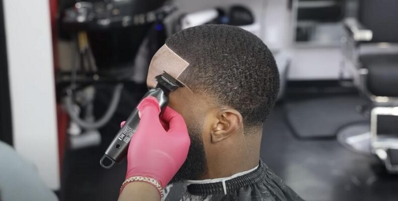 A man with a temple fade haircut.