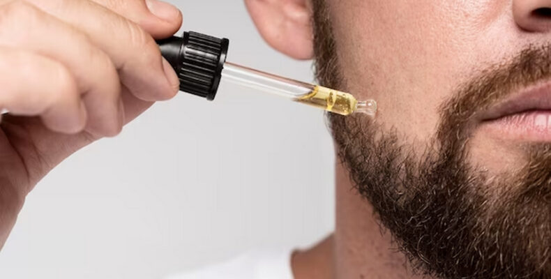 Man applying beard oil