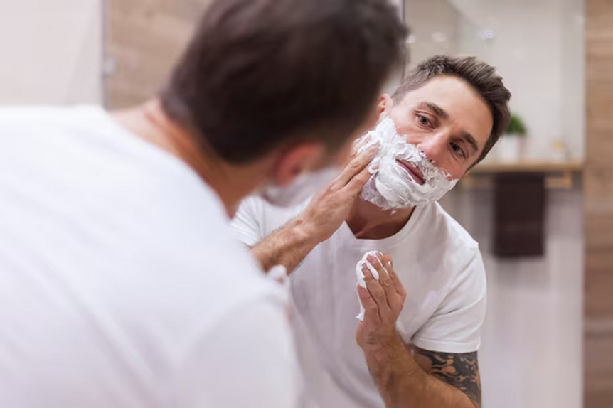 Man washing his beard 