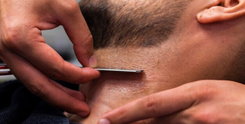 Man's neck being shaved